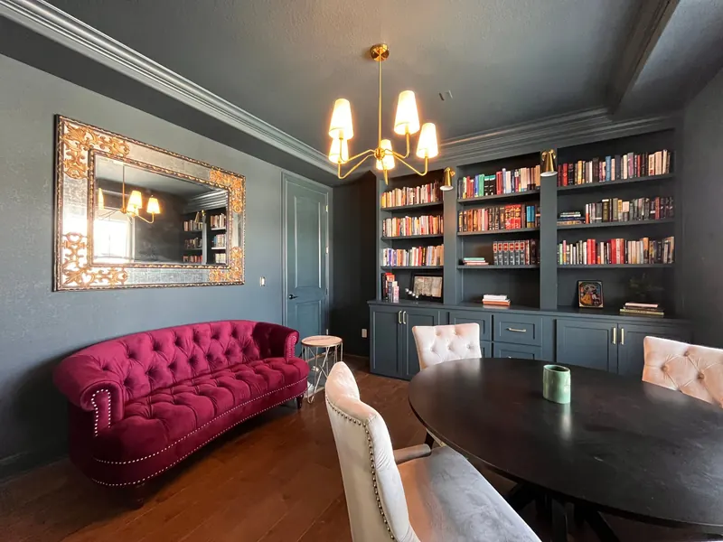 Repainted home library in charcoal with built-in bookshelves